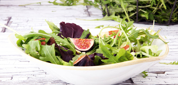 Mission figs in spring salad mix