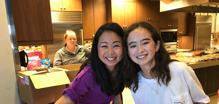 Mother and daughter making a gingerbread house