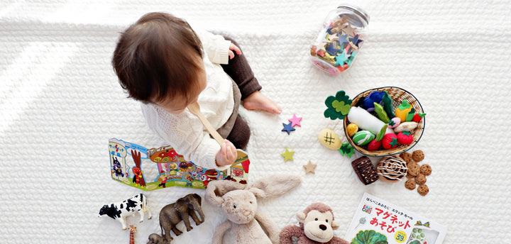 Boy surrounded by toys