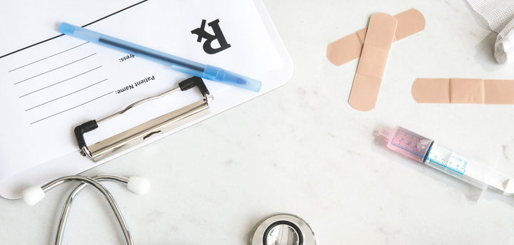 Patient form, bandaids and a syringe