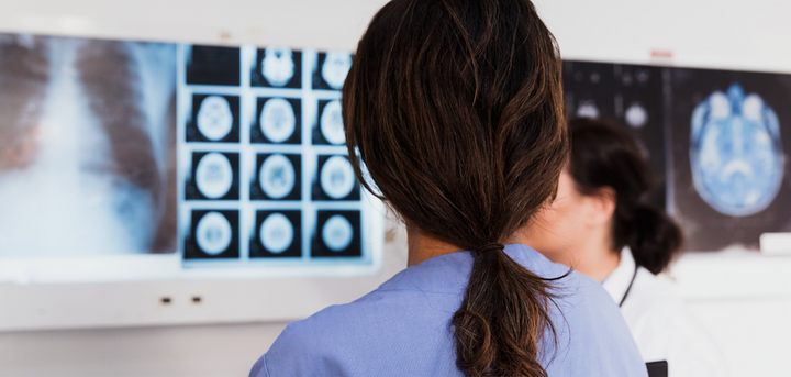 Medical professionals looking at an xray