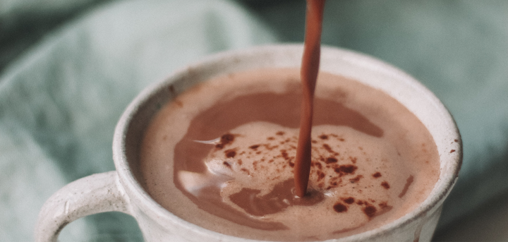 Hot chocolate being poured into a mug