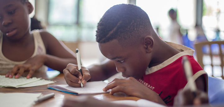Two kids doing school work