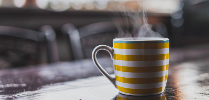 Mug on a table with hot liquid