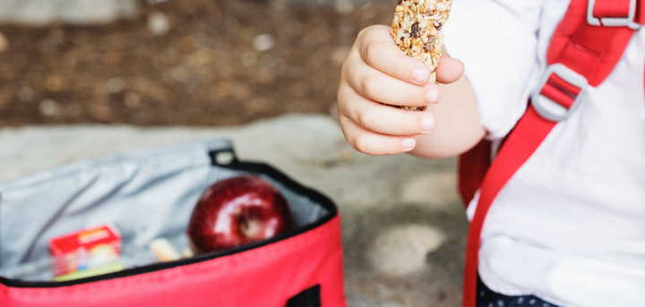 Boy eating a granola bar