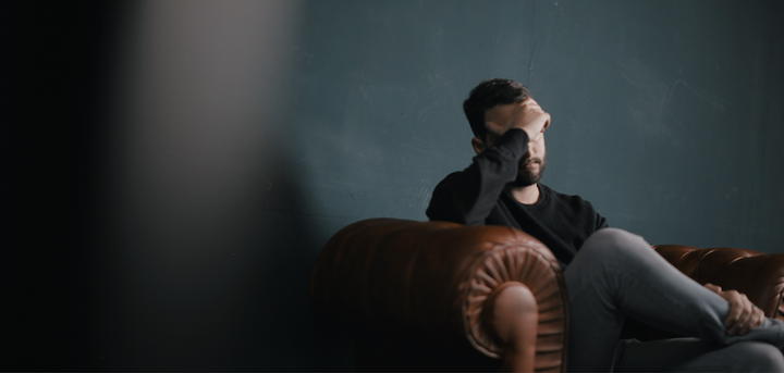 Man with head in his hand
